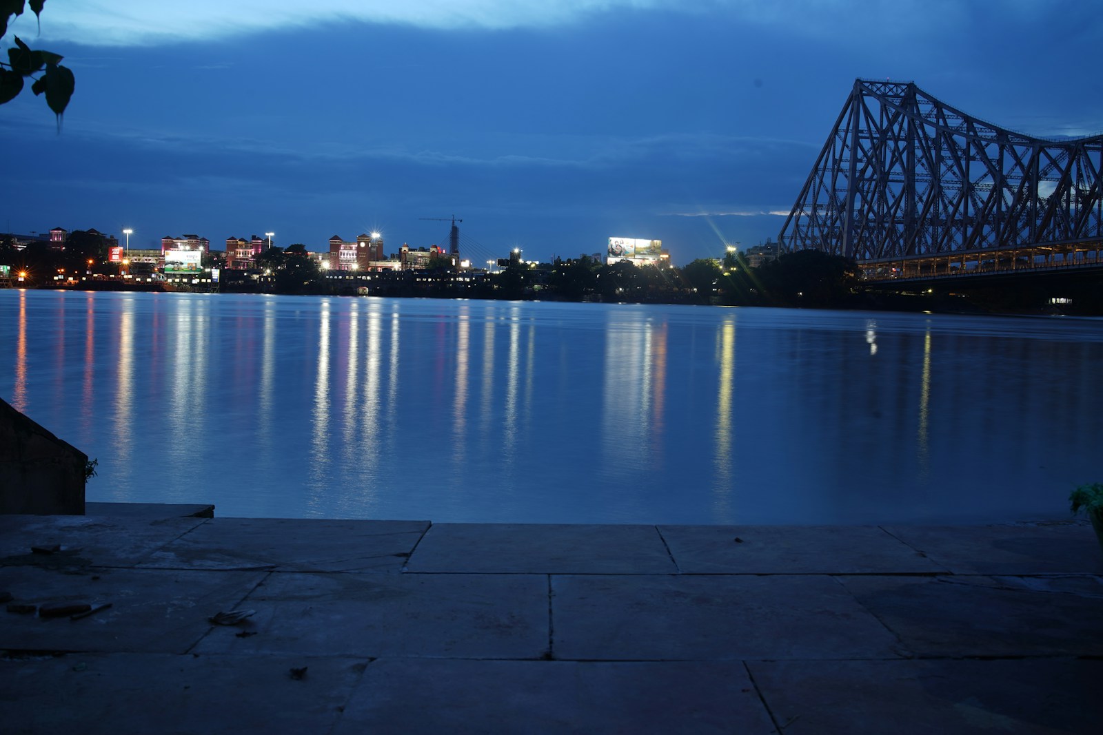 Howrah Bridge illuminated at night in Kolkata for Travvolt